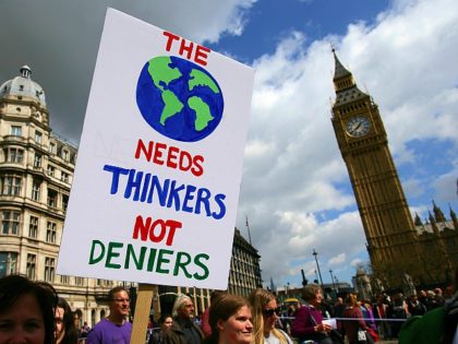 A protestor holds a placard as scientists and science enthusiasts participate in the 'March for Science' which celebrates the scientific method, in Westminster, central London on April 22, 2017, Earth Day. Thousands of people rallied in support for science in Europe and Australasia on April 22, ahead of a march …