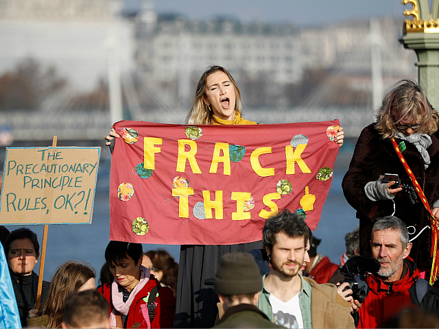 Demonstrators take part in a pro-environment protest as they block Westminster Bridge in c