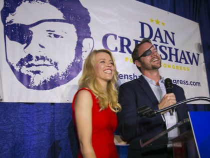 In this Tuesday, May 22, 2018, file photo, Republican congressional candidate Dan Crenshaw reacts to the crowd with his wife, Tara, as he comes on stage to deliver a victory speech during an election night party at the Cadillac Bar, in Houston. Crenshaw has chided “Saturday Night Live” comic Pete …