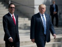 US President Donald J. Trump (R) and Secretary of Treasury Steven Mnuchin (L) walk out of the Treasury Department after a financial services Executive Order signing ceremon on April 21, 2017 in Washington, DC. President Trump is making his first visit to the Treasury Department for a memorandum signing ceremony …