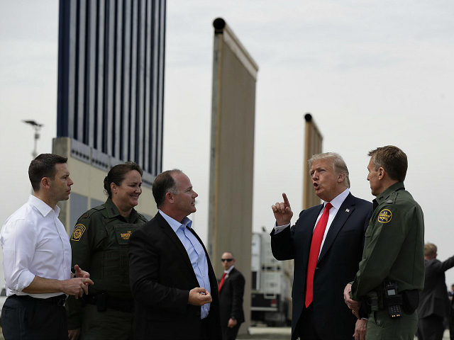 President Donald Trump reviews border wall prototypes, Tuesday, March 13, 2018, in San Diego. (AP Photo/Evan Vucci)