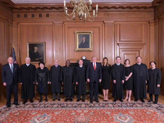 In this image provided by the Supreme Court, President Donald Trump poses for a photo with Associate Justice Brett Kavanaugh in the Justices' Conference Room before a investiture ceremony Thursday, Nov. 8, 2018, at the Supreme Court in Washington. From left are, retired Justice Anthony Kennedy, Associate Justices Neil Gorsuch, …