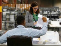 Election_2018_Florida_ap Employees at the Palm Beach County Supervisor of Elections office sort ballot pages during a recount on Wednesday, Nov. 14, 2018, in West Palm Beach, Fla. (AP Photo/Brynn Anderson)
