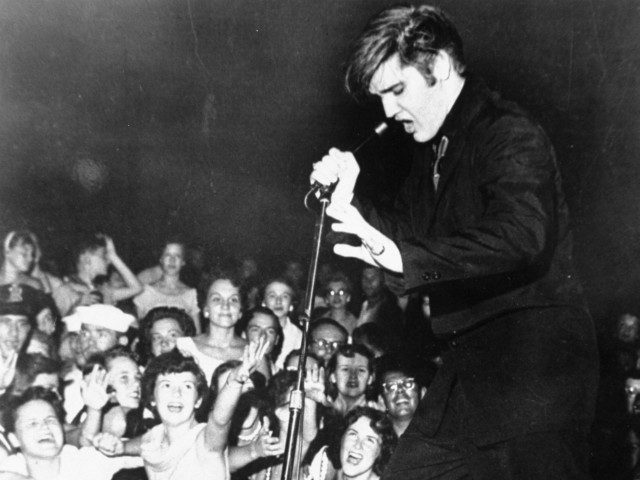 Elvis Presley shakes, rattles, and rolls as he performs at the Mississippi-Alabama State F