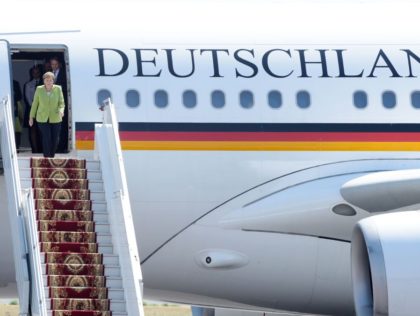 German Chancelor Angela Merkel gets off her plane arrives in Yerevan on August 24, 2018, a