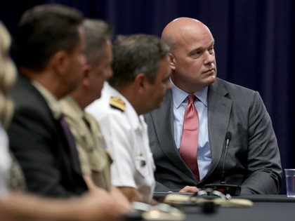 WASHINGTON, DC - AUGUST 29: Department of Justice Chief of Staff Matt Whitaker (R) partici