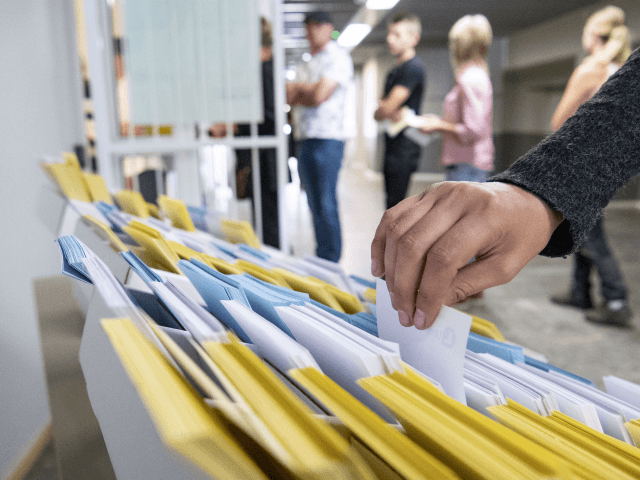 Voters takes ballots at a polling station before voting in the general elections on September 9, 2018 in Tomelilla, Sweden. (Photo by Johan NILSSON / TT NEWS AGENCY / AFP) / Sweden OUT (Photo credit should read JOHAN NILSSON/AFP/Getty Images)