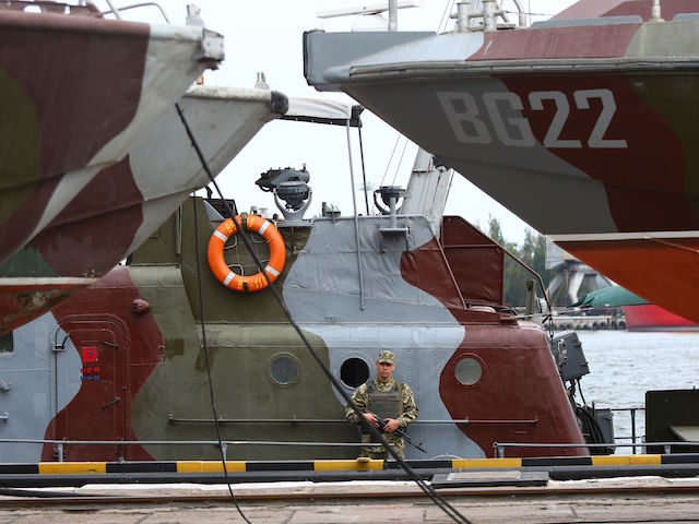 Ukrainian frontier stands aboard a patrol boat at the commercial port of Mariupol on the S