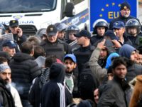 BOSNIA-CROATIA-MIGRANTS-BORDER A group of approximately 100 Asian migrants face a police blockade, in the vicinity of Maljevac border crossing near Northern-Bosnian town of Velika Kladusa, on October 24, 2018. - Illegal migrants gathered near the border crossing in an attempt to cross into neighboring Croatia. Officers of Bosnian border police and …