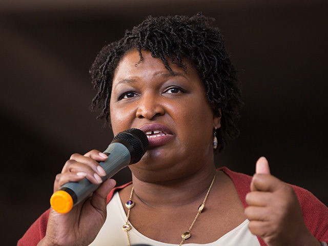ATLANTA, GA - OCTOBER 28: Democratic Georgia Gubernatorial candidate Stacey Abrams talks to a crowd gathered for the "Souls to The Polls" march in downtown Atlanta on October 28, 2018 in Atlanta, Georgia. Alongside artist Common and Ambassador Andrew Young, Abrams marched with voters to a polling station open for …