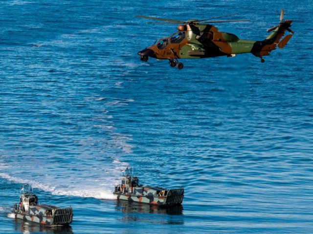 French Tigre attack helicopter supports Dutch Landing Crafts as they carry Finnish and Dut