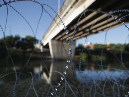 HIDALGO, TX - NOVEMBER 03: Protective wire stretches along the Rio Grande after being inst