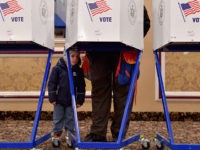 US-POLITICS-VOTE A voter casts his ballot in the midterm election at the East Midwood Jewish Center polling station in the Brooklyn borough of New York City on November 6, 2018. - Americans started voting Tuesday in critical midterm elections that mark the first major voter test of Donald Trump's presidency, with …