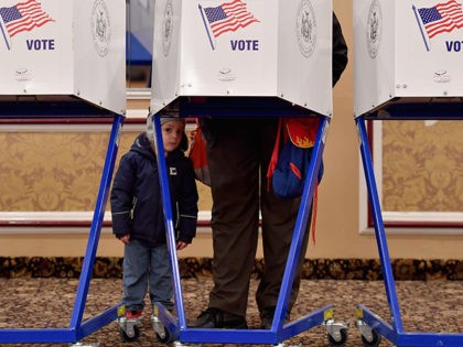 A voter casts his ballot in the midterm election at the East Midwood Jewish Center polling station in the Brooklyn borough of New York City on November 6, 2018. - Americans started voting Tuesday in critical midterm elections that mark the first major voter test of Donald Trump's presidency, with &hellip;