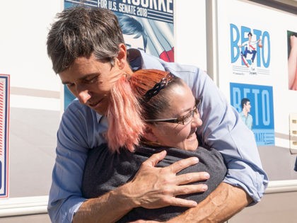 Texas Senatorial Candidate Congressman Beto ORourke hugs a constituent outside of a polling location at Nixon Elementary School in El Paso, Texas, on November 6, 2018. - Americans started voting Tuesday in critical midterm elections that mark the first major voter test of US President Donald Trump's controversial presidency, with …