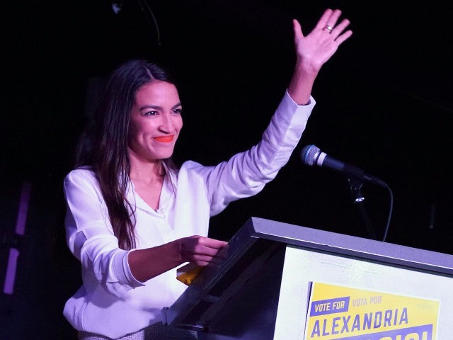 Alexandria Ocasio-Cortez arrives on stage to speak to her supporters during her election night party in the Queens Borough of New York on November 6, 2018. - 28-year-old Alexandria Ocasio-Cortez from New Yorks 14th Congressional district won Tuesdays election, defeating Republican Anthony Pappas and becomes the youngest woman elected to …