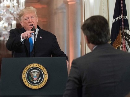 US President Donald Trump gets into a heated exchange with CNN chief White House correspondent Jim Acosta (R) during a post-election press conference in the East Room of the White House in Washington, DC on November 7, 2018. (Photo by Jim WATSON / AFP) (Photo credit should read JIM WATSON/AFP/Getty …