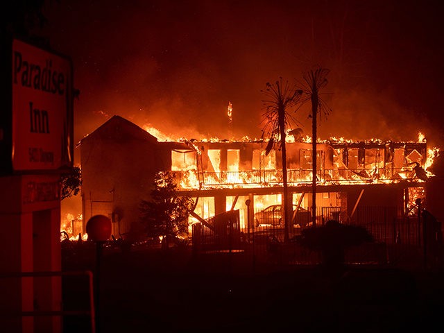 TOPSHOT - The Paradise Inn hotel burns as the Camp Fire tears through Paradise, North of Sacramento, California on November 08, 2018. - More than one hundred homes, a hospital, a Safeway store and scores of other structures have burned in the area and the fire shows no signs of …