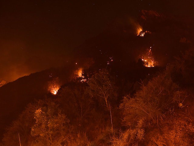Spot fires burn on the hills above Pepperdine University during the Woolsey fire, November