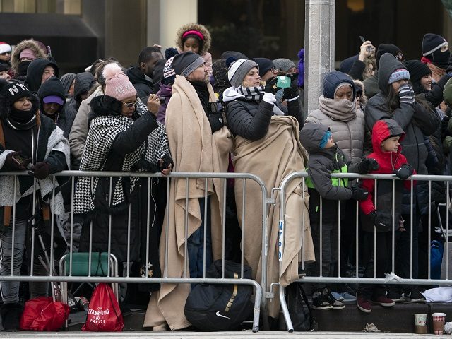 The crowd bundles up against the cold to watch the 92nd Annual Macy's Thanksgiving Day Par