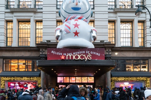 NEW YORK, NY - NOVEMBER 22: Customers wait in the cold outside the Herald Square Macy&#039