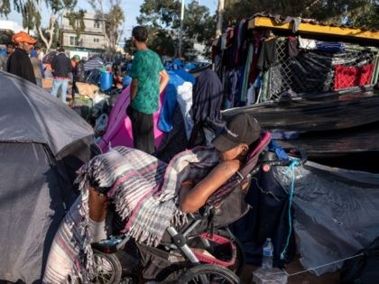 Central American migrants wanting to reach the United States, rest at a temporary shelter