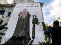 TUNISIA-SAUDI-POLITICS-KHASHOGGI This picture taken on November 26, 2018 shows a giant banner hanging at the headquarters of Tunisia's Journalists Union in the capital Tunis depicting a cartoon of Saudi Crown Prince Mohammed bin Salman holding a chainsaw with a caption above reading in Arabic "no to the desecration of Tunisia, the …