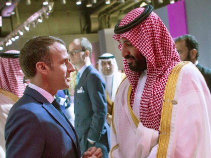 Saudi Crown Prince Mohammed bin Salman (R) meets with French President Emmanuel Macron in