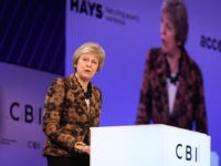 The 2018 CBI Conference Takes Place On The Greenwich Peninsular LONDON, ENGLAND - NOVEMBER 19: British Prime Minister Theresa May speaks during the 2018 CBI Conference on November 19, 2018 in London, England. Theresa May defended her draft Brexit agreement before the audience of business leaders, asserting that the deal will restore UK control over its money, laws, and borders. …