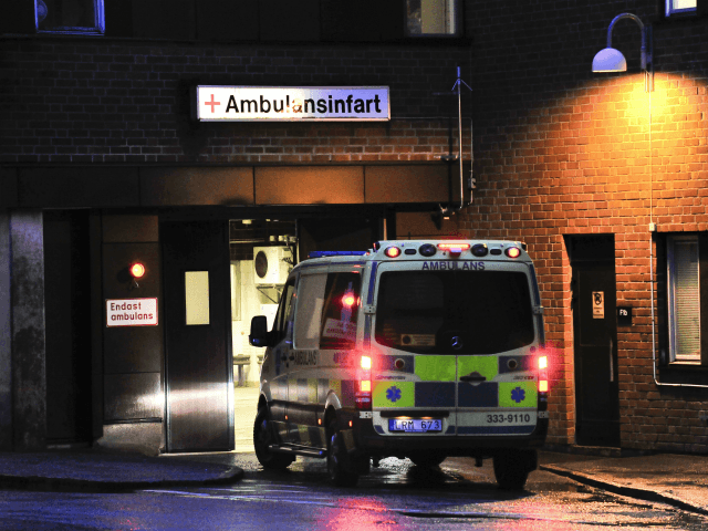 An ambulance arrives at the emergency entrance at the Karolinska hospital in Stockholm on March 30, 2012 where former French Prime Minister Michel Rocard was taken into intensive care. Rocard, an 81-year-old Socialist veteran, has fallen ill in the Swedish capital and was treated in intensive care, the French foreign …