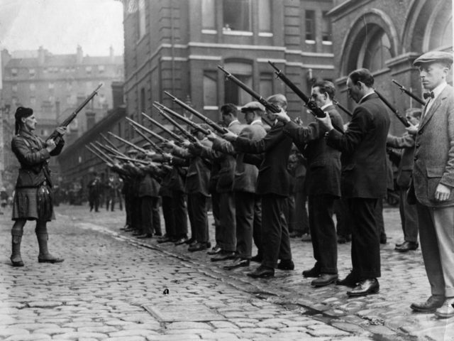 1914: Members of the London Scottish Regiment undertake rifle drill.. The London Scottish