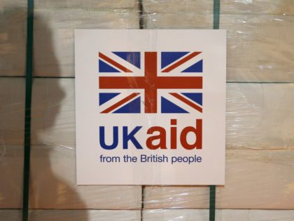 KEMBLE, UNITED KINGDOM - AUGUST 14: A UK aid label attached to a box containing kitchen sets, which are stored at a UK Aid Disaster Response Centre at Cotswold Airport on August 14, 2014, in Kemble, United Kingdom. The Prime Minister will hold a meeting with the COBRA emergency committee …