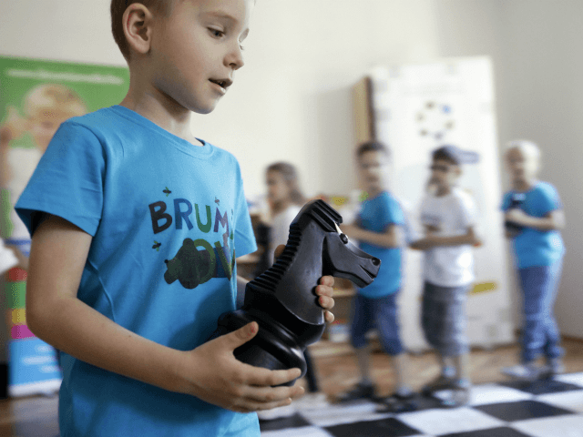 Children play chess on June 14, 2017 at the 'Brumi' preschool in Budapest, with