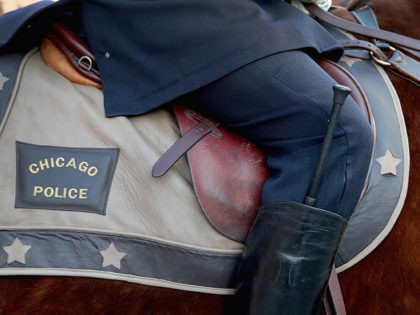 CHICAGO, IL - FEBRUARY 16: Chicago mounted police honor Commander Paul Bauer as his remains are carried into the Nativity of Our Lord church in the Bridgeport neighborhood on February 16, 2018 in Chicago, Illinois. Bauer was shot and killed on February 13, while trying to help stop a man …