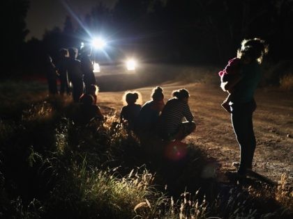 MCALLEN, TX - JUNE 12: U.S. Border Patrol agents arrive to detain a group of Central American asylum seekers near the U.S.-Mexico border on June 12, 2018 in McAllen, Texas. The group of women and children had rafted across the Rio Grande from Mexico and were detained before being sent …