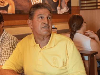 Senator Joe Manchin speaks to Michelle Cowley about her opinion on his recent vote in the Senate to confirm Brett Kavanaugh, Sunday, Oct. 7, 2018 at IHOP Charleston W.Va. A day after Manchin broke with his party on what may be the most consequential vote of the young Trump era, …