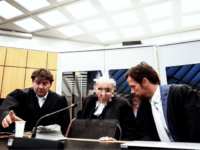 NOVEMBER 6: (EDITORS NOTE: Defendant's face pixeled by court order) Defendant Dr. Johann R. (C) with his lawyers attends a session of the trial against him at the Regional Court in Muenster, Germany, 06 November 2018. The 94-year-old accused and former SS guard Dr. Johann R. faces trial, charged with …