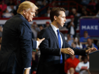 Republican Senate candidate Josh Hawley is guided to the podium to speak by President Donald Trump during a rally at Show Me Center, Monday, Nov. 5, 2018, in Cape Girardeau, Mo.. (AP Photo/Carolyn Kaster)