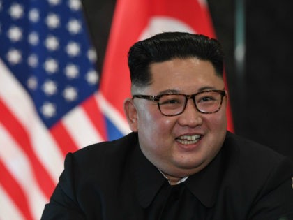 North Korea's leader Kim Jong Un reacts at a signing ceremony with US President Donald Trump (not pictured) during their historic US-North Korea summit, at the Capella Hotel on Sentosa island in Singapore on June 12, 2018. - Donald Trump and Kim Jong Un became on June 12 the first …