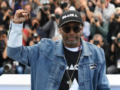 CANNES, FRANCE - MAY 15: Director Spike Lee holds up a fist as he attends the photocall fo