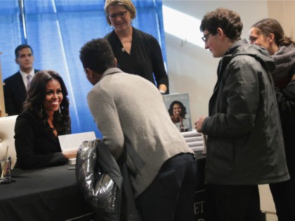 Former first lady Michelle Obama kicks off her Becoming book tour with a signing at the Seminary Co-op bookstore on November 13, 2018 in Chicago, Illinois. In the book, which was released today, Obama describes her journey from Chicago's South Side to the White House. (Photo by Scott Olson/Getty Images)