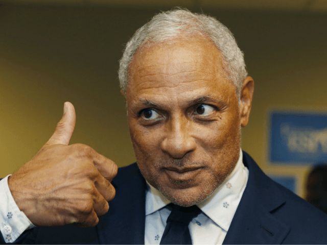 In this Friday, Sept. 7, 2018 photo, Mike Espy, a Democrat and former President Bill Clinton's first agriculture secretary, gives a thumbs up sign of approval at the Jackson, Miss., opening of his campaign headquarters, as to the direction of his campaign for November's special election to fill the unexpired …