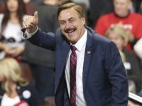 Mike Lindell, inventor and founder of My Pillow, gives a thumbs up before a rally address by President Donald Trump Thursday, Oct. 4, 2018, in Rochester, Minn. (AP Photo/Jim Mone)
