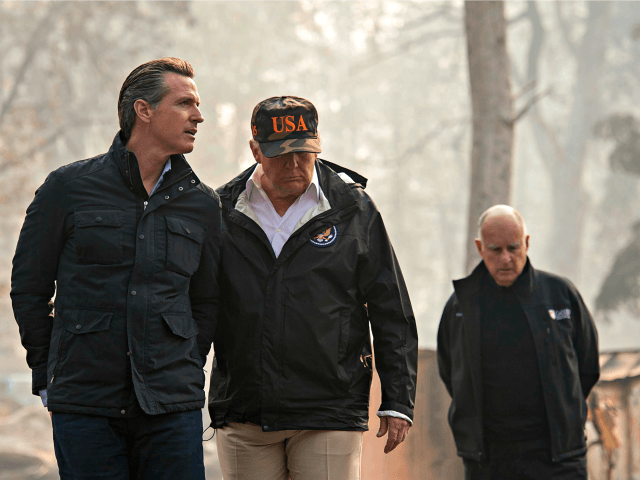 Trump California Wildfires President Donald Trump talks with California Gov.-elect Gavin Newsom during a visit to a neighborhood destroyed by the wildfires, Saturday, Nov. 17, 2018, in Paradise, Calif. At right is California Gov. Jerry Brown.