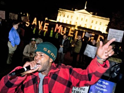 Protesters gather in front of the White House in Washington, Thursday, Nov. 8, 2018, as part of a nationwide "Protect Mueller" campaign demanding that Acting U.S. Attorney General Matthew Whitaker recuse himself from overseeing the ongoing special counsel investigation.
