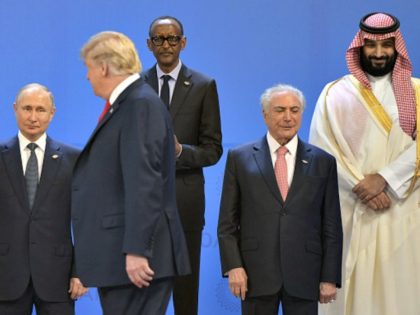 (L to R) Russia's President Vladimir Putin, US President Donald Trump, Rwandas President Paul Kagame, Brazil's President Michel Temer and Saudi Arabia's Crown Prince Mohammed bin Salman line up for a family photo, during the G20 Leaders' Summit in Buenos Aires, on November 30, 2018. - Global leaders gather in …
