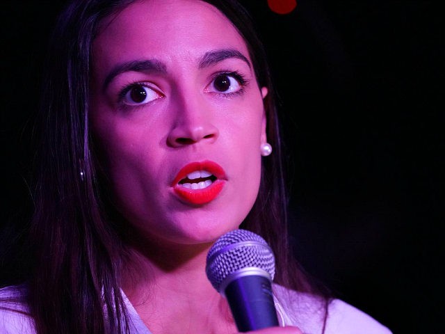 Alexandria Ocasio-Cortez speaks to her supporters during her election night party in the Q