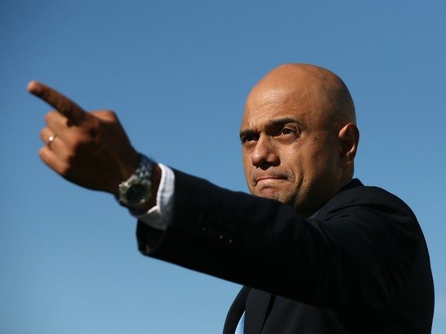 LONDON, ENGLAND - SEPTEMBER 10: Business Secretary Sajid Javid gestures after a photocall with executives from British car manufacturers on September 10, 2015 in London, England. Executives were joined by Business Secretary Sajid Javid as they stood alongside 10 of the most exciting British-built cars before they head off to …