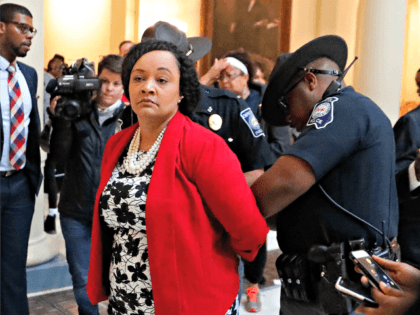 Sen. Nikema Williams (D-Atlanta) is arrested by capitol police during a protest over election ballot counts in the rotunda of the state capitol building Tuesday, Nov. 13, 2018, in Atlanta. Dozens filled the rotunda in the center of the Capitol's second floor Tuesday just as the House was scheduled to …