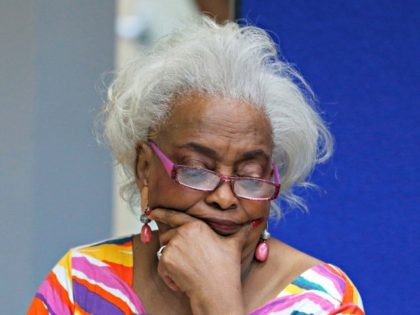 Brenda Snipes, Broward County Supervisor of Elections, looks at a ballot during a canvasing board meeting Friday, Nov. 9, 2018, in Lauderhill, Fla. The deeply purple state will learn Saturday afternoon whether there will be recounts in the bitter and tight U.S. Senate race between Republican Gov. Rick Scott and …